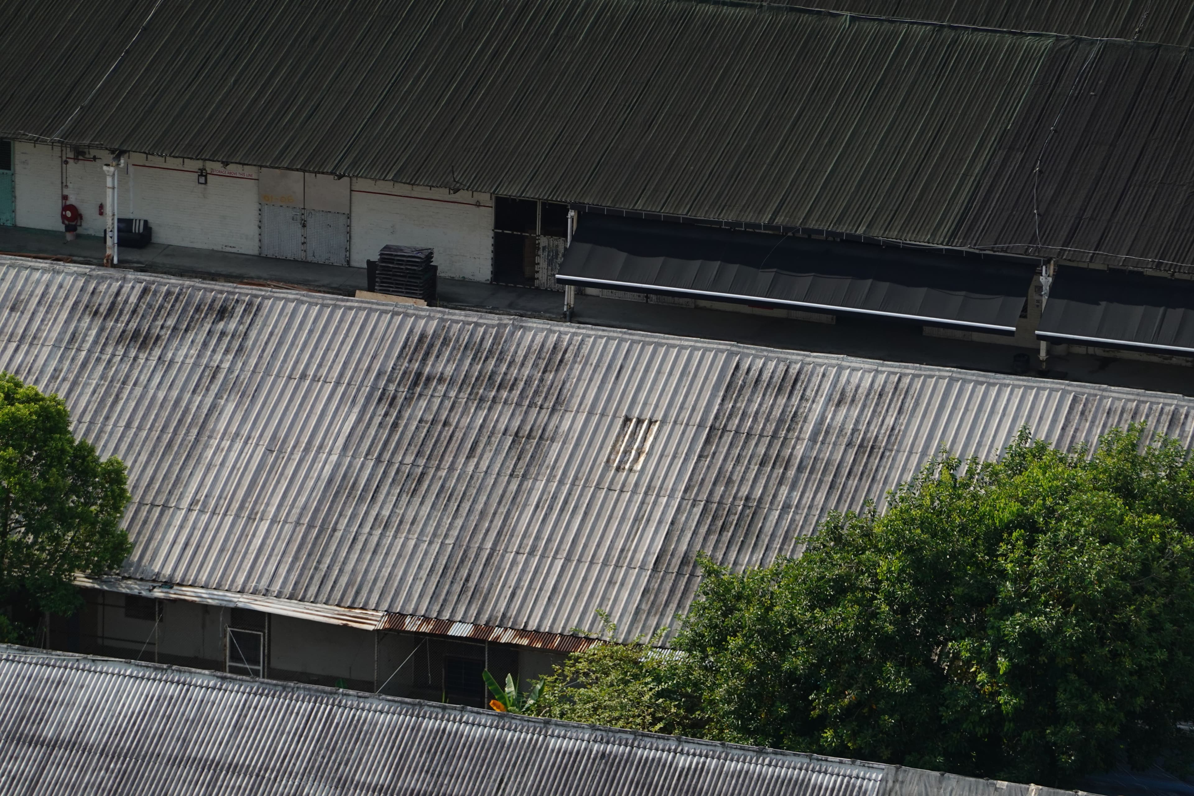 Aerial view of corrugated metal warehouse roofs