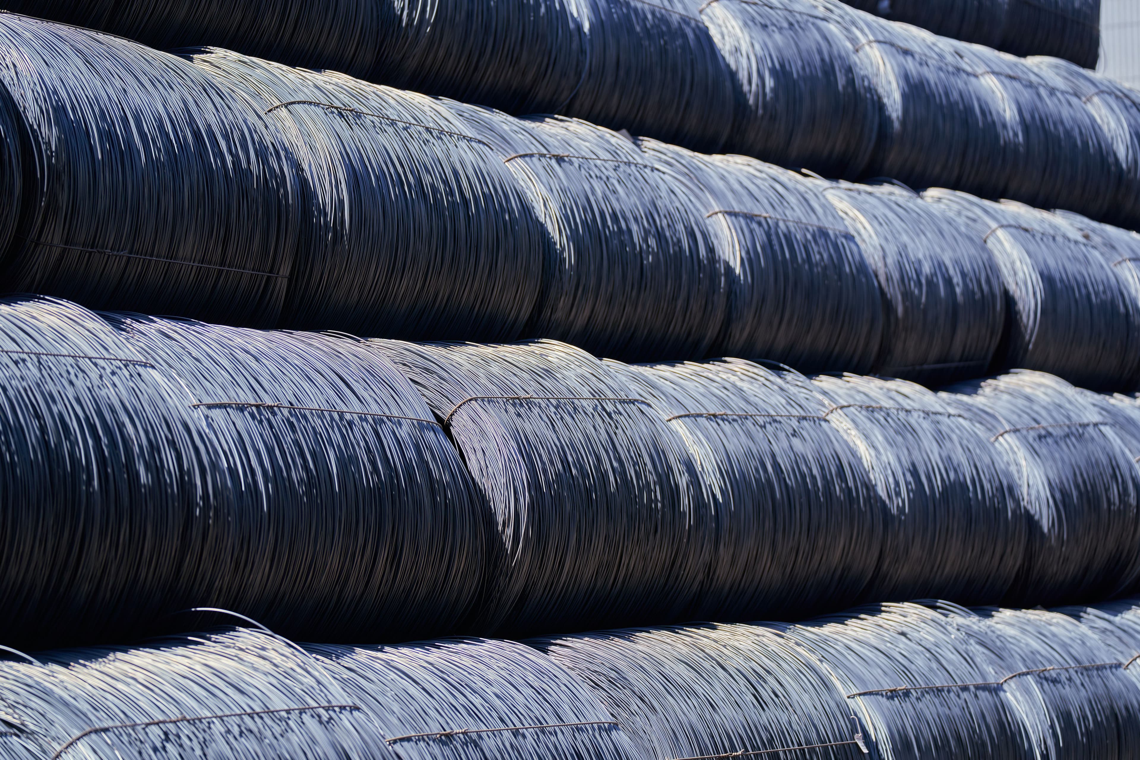 Stacked cold rolled steel coils in an industrial yard